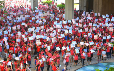 Teachers rally for more education funding.